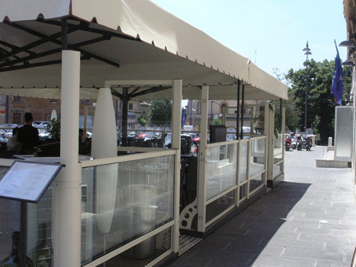 cream awning that is raised up a bit and a menu stand in the bottom left corner